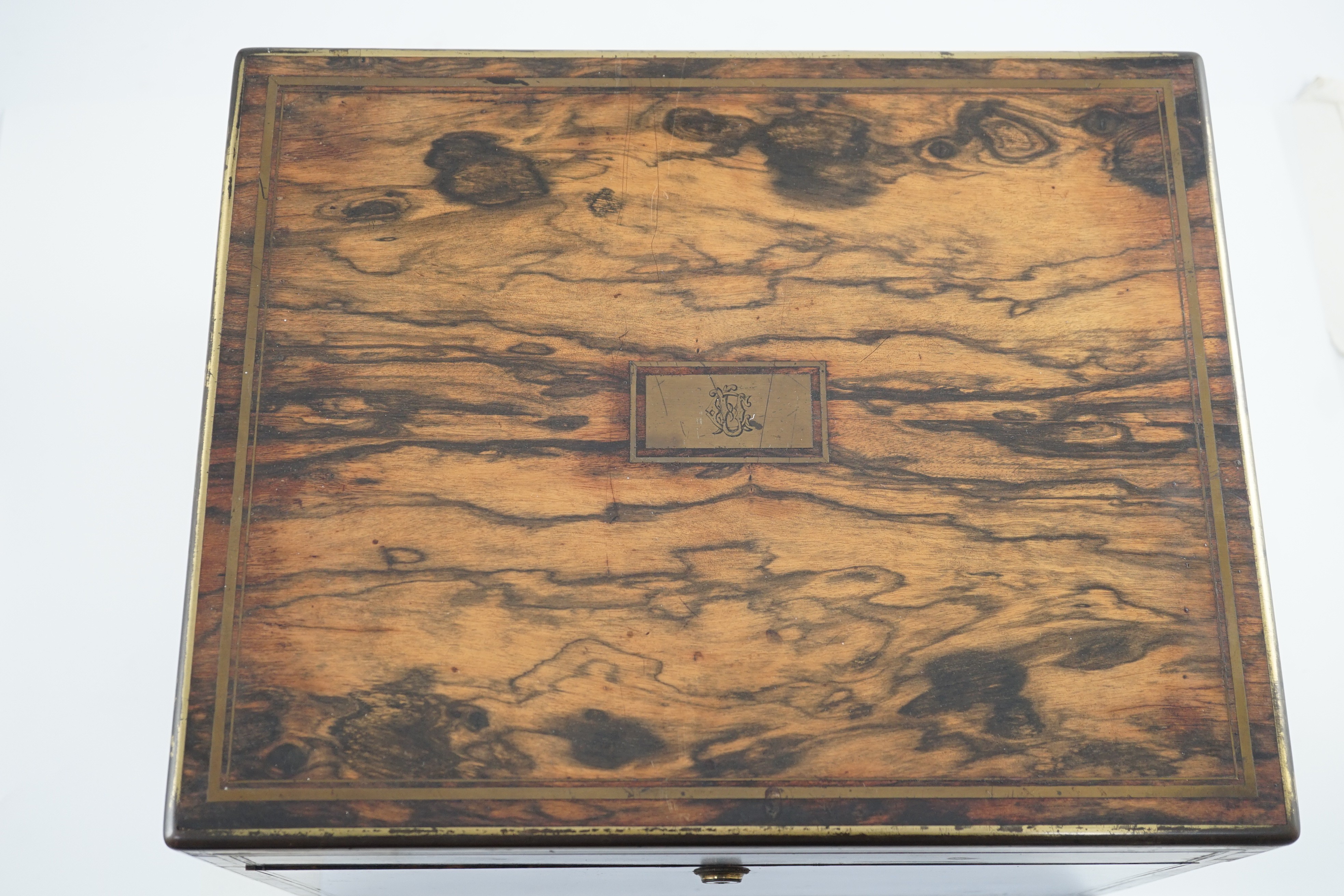 A Victorian brass mounted coromandel wood toilet box, containing fourteen engraved silver mounted toilet jars, by Thomas Whitehouse, London, 1865